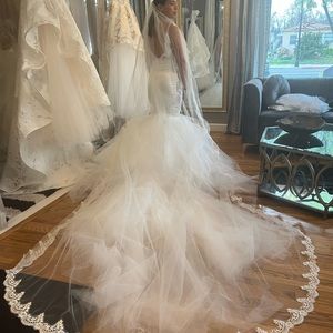Never worn, custom made wedding dress.